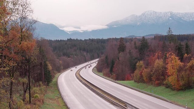 Motorway A95 with cloudy mountain range