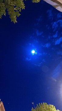 time lapse video of the movement of the moon, clouds and stars on a nearly full moon night