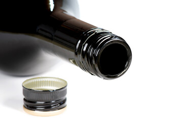 Empty black bottle from alcohol drink, close up. Design mockup.