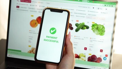 A woman's hand holds a smartphone on screen with the message money sent and received. Grocery shopping online. Concept of financial transactions with mobile devices. Closeup, money, transfer, Payment - Powered by Adobe