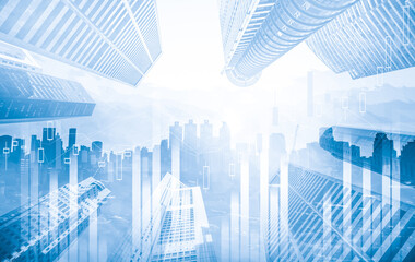 As background for a financial or business concept, digital screen and financial graphs overlap on a picture of modernistic cityscape, skyscrabbers.