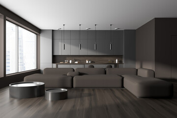 Front view on dark studio room interior with panoramic window