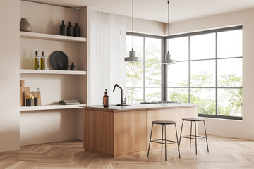 Beige kitchen interior with bar countertop, kitchenware and panoramic window