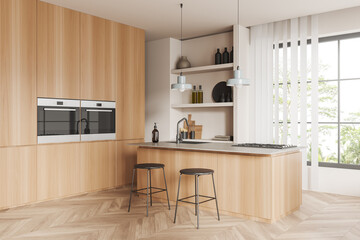 Stylish kitchen interior with bar countertop, kitchenware and panoramic window