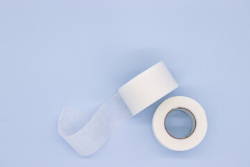 hypoallergenic sugical tape on blue background