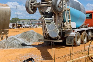 Mixer truck providing pour wet cement concreting on construction area