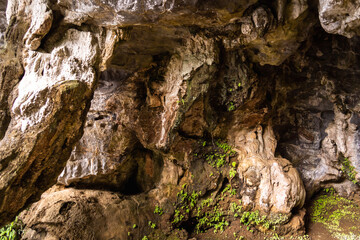 Big dark stone cave inside near entrance