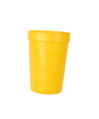 Bright yellow plastic glass insulated on a white background.