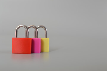 Red, pink and yellow isolated on a grey background. Copy space for the text.