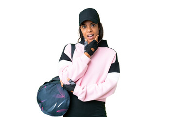 Young sport African American woman with sport bag over isolated chroma key background surprised and shocked while looking right