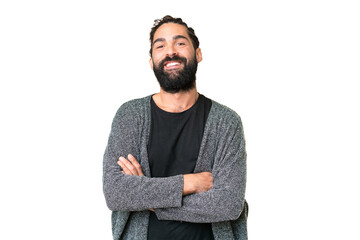 Young man with beard over isolated chroma key background keeping the arms crossed in frontal...