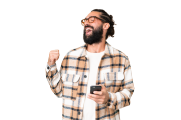 Young man with beard over isolated chroma key background with phone in victory position