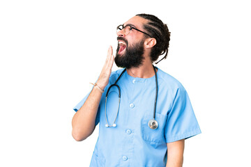 Young doctor man over isolated chroma key background yawning and covering wide open mouth with hand