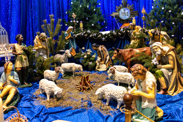 Christmas manger with figures of Jesus, Mary, Joseph, sheep, bulls, donkeys and wise men. Christmas.