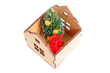 Christmas tree in a toy house on white