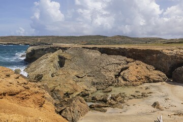 Fototapeta na wymiar Beautiful rocky coastline natural landscape view. Atlantic Ocean, Aruba. 