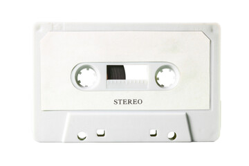 Isolated old vintage cassette tape, obsolete music tech from the 1980s. Light grey plastic body, white label with the text Stereo.
