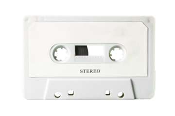 Isolated old vintage cassette tape, obsolete music tech from the 1980s. Light grey plastic body, white label with the text Stereo.
