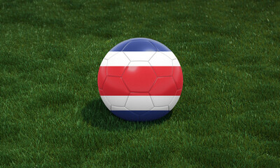 Soccer ball with Costa Rica flag colors at a stadium on green grasses background.