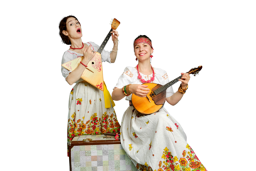 Women musicians in Russian folk dresses with musical instruments on a isolated white background. Happy artists from Russia in white national clothes with stringed musical instruments