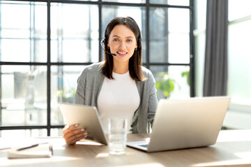 Customer support operator working in a call center office