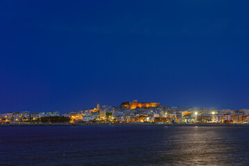 Vieste, Italy. View of the town of Vieste at night. Above, the Swabian Aragonese Castle with the...