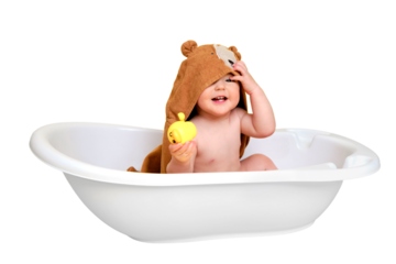 Happy baby toddler boy with hooded towels in a tub, isolated on white background. A smiling child at the age of one year, copy space