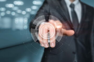 Businessman clicks on play button .