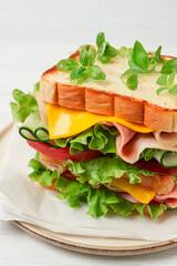 Club sandwich, on a white table, close-up, no people, horizontal, homemade,