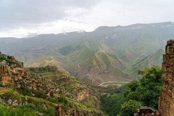 Picturesque beautiful mountain landscape after rain. Green mountain valley under cloudy grey sky