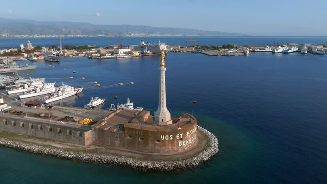 View of the Messina's port with the gold Madonna della Lettera statue, Italy.