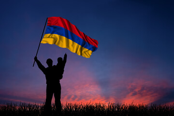 Father and son hold the flag of Armenia