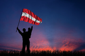 Father and son hold the flag of Austria