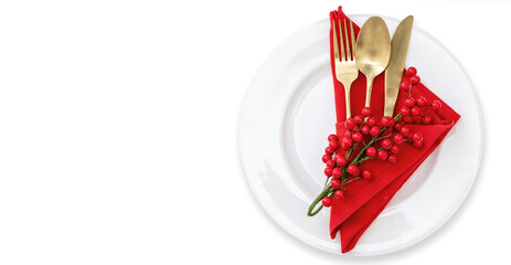 Holiday table setting. Golden Cutlery and red cloth napkin isolated on white, top view