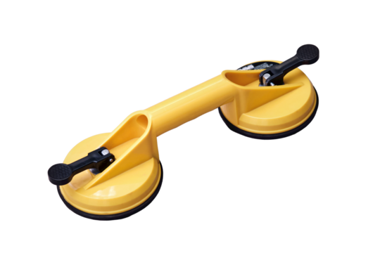 Yellow handheld device with vacuum suction cups for lifting floor panels, isolated on a white background