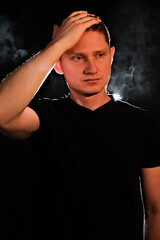 silhouette of a guy. men in the dark. smoke . steam . man in a dark room.