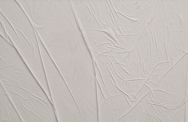 Empty crumpled wet craft paper blank texture copy space wall background. Gray beige pastel color.