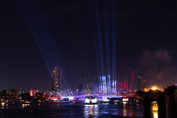Fototapeta na wymiar ‘Vijit Chao Phraya’ lighting extravaganza opens in Bangkok to great fanfare at Phra Phuttha Yodfa Bridge (Memorial Bridge). Illumination and light shows along the Chao Phraya River. Public event.