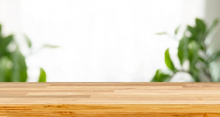 Empty wooden table with bokeh background and sun light for text ,Template mock up and display of product. green nature