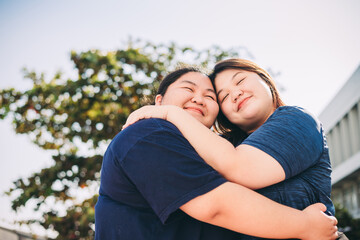 Fototapeta premium Friendship young girls have fun and hug in outdoor - portrait of couple of caucasian females stay together in love - lgbt people free rights concept.