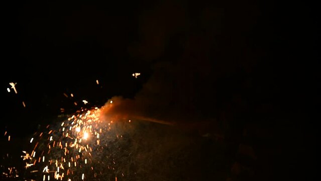 Colorful Firecrackers in Diwali Festival 4K Stock Footage. Fire crackers or Fire works Firework on the ground.