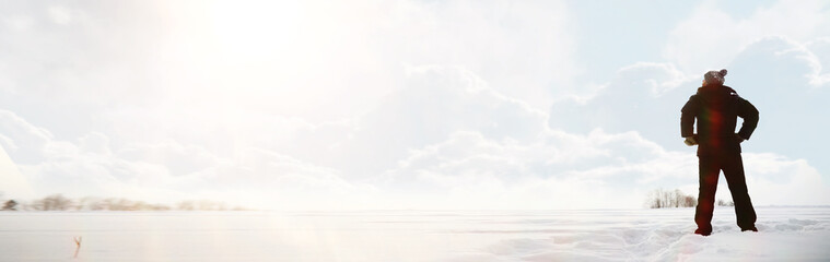 A man on a walk. Winter landscape. Tourist in winter journey.