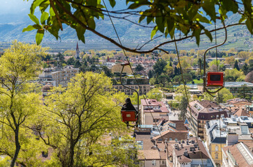 Merano (Meran) in South Tyrol: The chairlift Meran- Dorf Tirol, also known as Panoramalift - Trentino Alto Adige, northern Italy - april 11, 2022 - obrazy, fototapety, plakaty