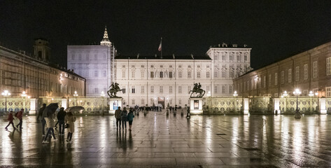Fototapeta na wymiar The beautiful Castle Square in Turin with the Royal Palace illuminated at night