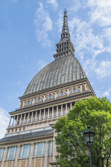 Fototapeta premium The beautiful Mole Antonelliana in Turin agains a blue sky