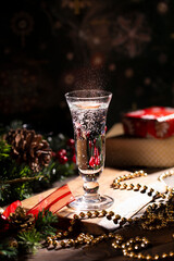 Celebration of Christmas and New Year with champagne. Decorated Christmas table. Champagne glass