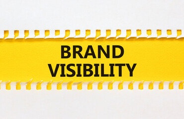 Brand visibility symbol. Concept words Brand visibility on yellow paper. Beautiful white...