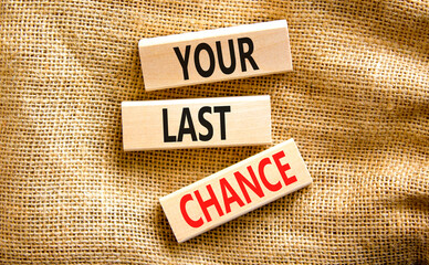 Time to your last chance symbol. Concept words Your last chance on wooden blocks on a beautiful canvas table canvas background. Business and your last chance concept. Copy space.