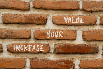Increase your value symbol. Concept words Increase your value on brick wall. Beautiful brick wall background. Business increase your value concept. Copy space.