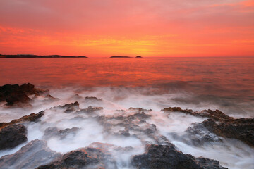 Fototapeta na wymiar Waves crashing on Bombay Beach, Santa Eulalia, Ibiza, Balearic Islands, Spain. Europe.